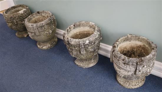 Four stone urns H.40cm